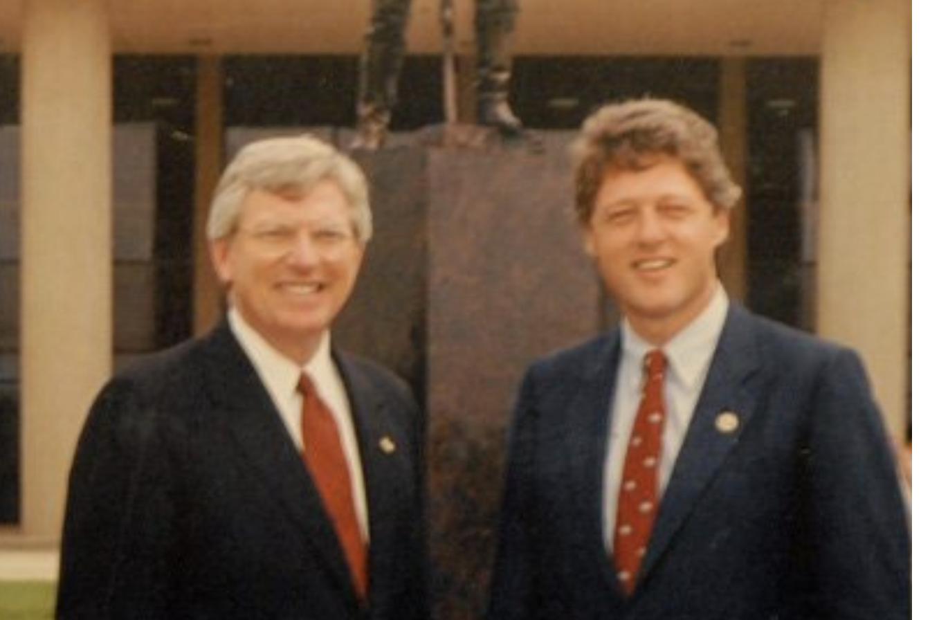 Governor Mark White standing with Governor Bill Clinton of Arkansas.